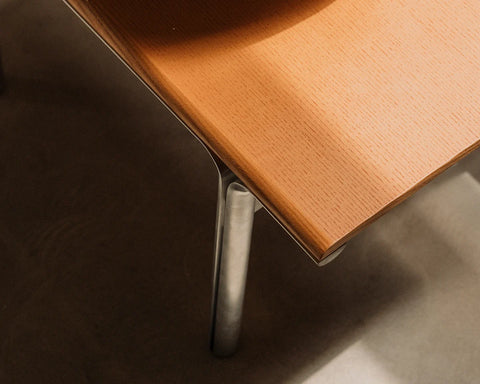 Frama Union Coffee Table in Warm Brown Ash and Aluminum, close up of a corner where the rounded aluminum leg meets the ash top
