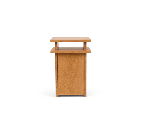 Frama Ratio Side Table in Warm Brown Birch, small birch cabinet with a closed door and a floating top panel raised on short posts