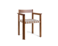 Frama Symmetry Armrest Chair in Oat Fabric and Honey Ash, ash chair seen from the corner showing the wide armrests and woven seat straps