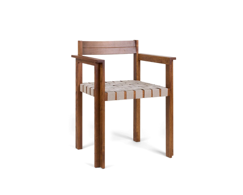 Frama Symmetry Armrest Chair in Oat Fabric and Honey Ash, ash chair seen from the corner showing the wide armrests and woven seat straps