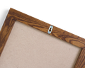 Frama Symmetry Mirror, back of the mirror showing the board backing panel and a small metal keyhole hanger on the top rail