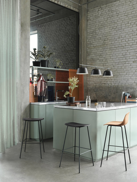 scandinavian inspired kitchen with muuto fiber bar stool