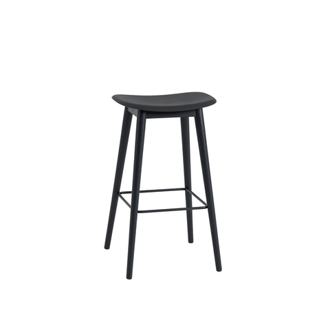 muuto Fiber Bar Stool with wood legs and no back rest, black seat and black base