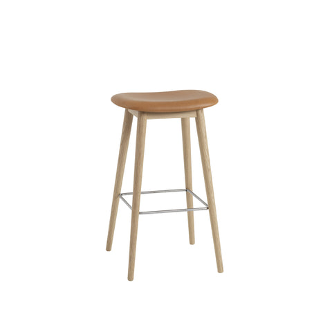 muuto Fiber Bar Stool with wood legs and no back rest, refine leather cognac seat and oak base