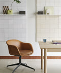 scandinavian workstation with oak desk and leather chair