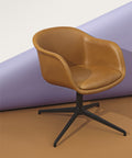 scandinavian armchair in cognac leather and black base by muuto 