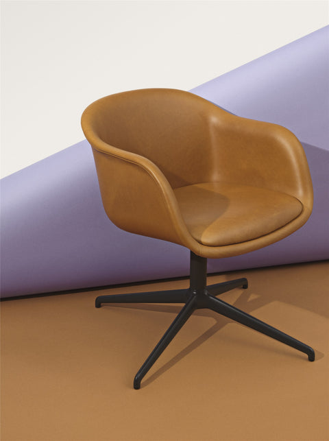 scandinavian armchair in cognac leather and black base by muuto 