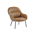 muuto lounge chair with tube base in refine leather cognac and anthracite black