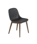 fiber side chair with black shell and dark stained wood base by muuto