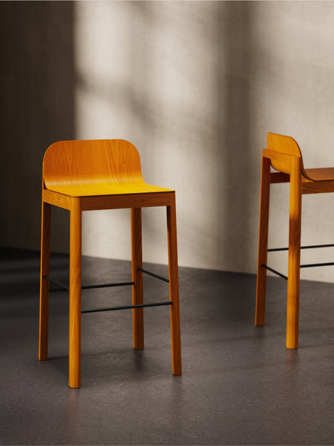 EDITS Cleo Bar Stool in tangerine orange wood finish with black footrest, modern Canadian furniture design