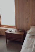 Form & Refine A Line Storage Bench 68, oak storage bench with lid, smoked oak storage bench used as a bedside table in a wood-panelled bedroom