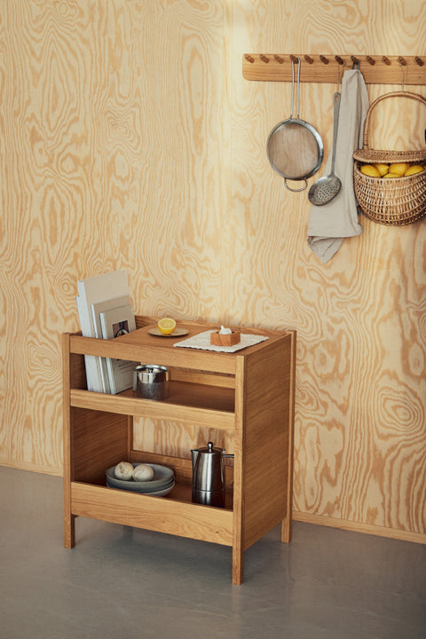Form & Refine Echo Coat Rack 88, solid oak wall coat rack, oak coat rack with a sieve and basket above the Journal Organiser against a plywood wall