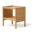 Form & Refine Journal Side Table, Oak, solid oak side table with magazine slot, three-quarter view on white background