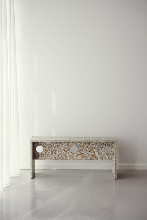 Form & Refine Remake Bench, recycled carton bench, the recycled-carton bench against a white wall, front view
