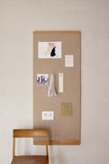 Form & Refine Rim Pinboard 60x145, tall oak-framed pinboard, tall oak-framed pinboard with pinned sketches above a Sonder chair and a desk