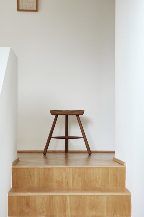 Form & Refine Shoemaker Chair™, No. 49, wooden Shoemaker stool, smoked oak Shoemaker stool on an oak landing at the top of a stair