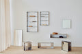 Form & Refine Taper Mirror Cabinet 40x40, steel mirror cabinet, the steel Taper series arranged along a white wall, shelves, cube and console