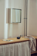 Form & Refine Taper Mirror Cabinet 40x40, steel mirror cabinet, steel mirror cabinet above a bathroom counter with a linen curtain beneath