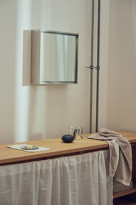 Form & Refine Taper Mirror Cabinet 40x40, steel mirror cabinet, steel mirror cabinet above a bathroom counter with a linen curtain beneath