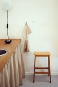 minimalist oak bar stool by form and refine in mid century modern kitchen