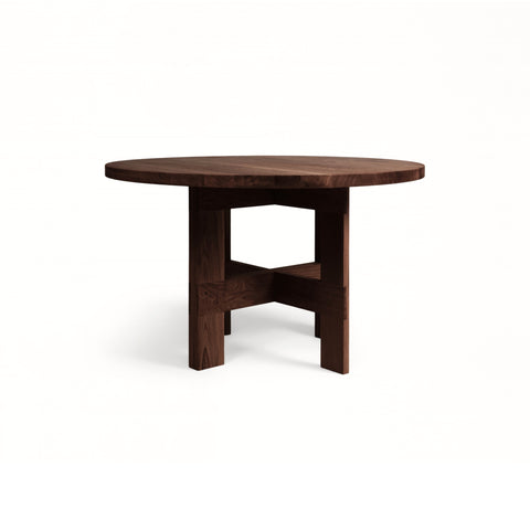 Frama Farmhouse Trestle Table in Dark Oak, round dark oak top on a crossed trestle base, straight on view on white