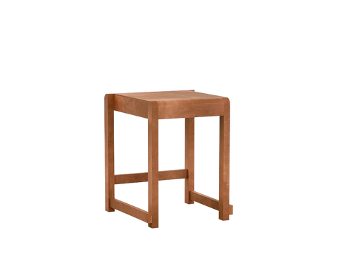 Frama Low Stool 01 in Warm Brown Birch, reddish brown birch stool with a flat seat and low side rails, three quarter view on white