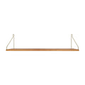 Frama Single Shelf in Natural Oak with brass brackets, 31.5 inch wide shelf 7.9 inches deep, straight on view on white