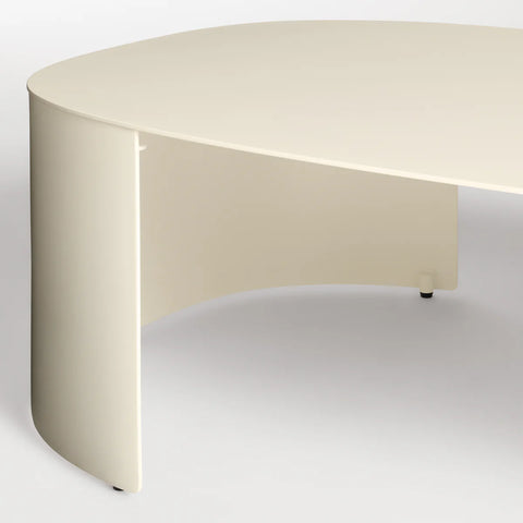 Bug Outdoor Coffee Table by Blu Dot in Ivory, curved leg and matte aluminum surface detail