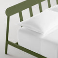 Blu Dot Goodie Bed in Olive green, close-up detail of slatted headboard and frame leg.