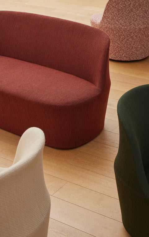 Close up of Fredericia Gomo Sofa in terracotta fabric with cream and green Gomo Lounge Chairs