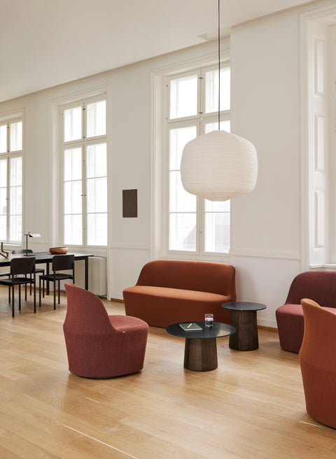 Fredericia Gomo Sofa and Gomo Lounge Chairs in terracotta with black Niveau side tables in a bright Scandinavian interior