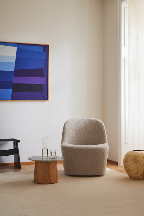 Gomo Lounge Chair in sand bouclé fabric in a modern Scandinavian living room.