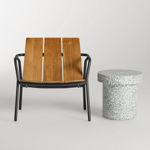 Hunky Dory Side Table by Blu Dot in White Terrazzo, styled with Offline Outdoor Lounge Chair