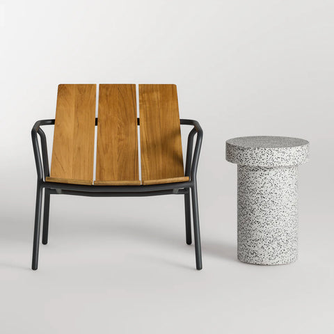 Hunky Dory Tall Side Table by Blu Dot in White Terrazzo, styled with Dog Days Outdoor Lounge Chair