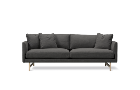 scandinavian black sofa with oak legs and dark grey fabric by fredericia furniture 