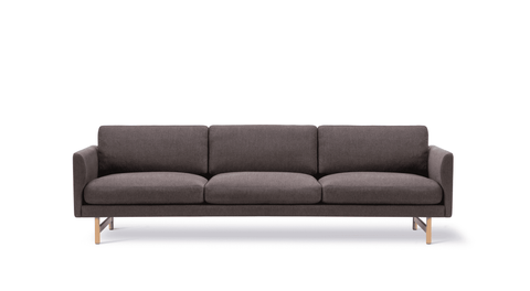 Studio front view of Fredericia Calmo 3 Seater in dark fabric with oak lacquered legs