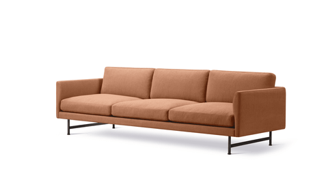Studio three quarter view of Calmo 3 Seater in terracotta fabric with black steel base