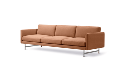 Studio three quarter view of Calmo 3 Seater in terracotta fabric with matte chrome base