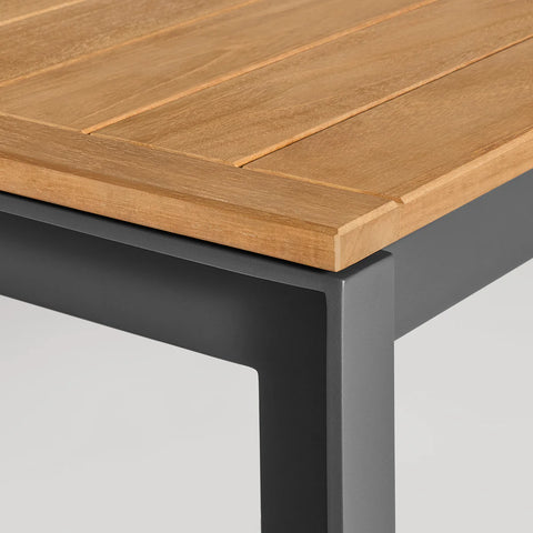 Hold Tight 76" Outdoor Dining Table by Blu Dot, FSC-certified teak slat top and Carbon aluminum frame, corner detail