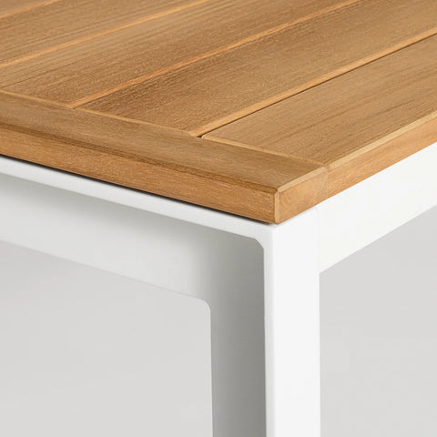 Hold Tight 76" Outdoor Dining Table by Blu Dot, FSC-certified teak slat top and White aluminum frame, corner detail