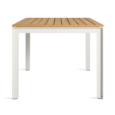 Hold Tight 76" Outdoor Dining Table by Blu Dot in Teak / White, side view