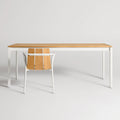 Hold Tight 76" Outdoor Dining Table by Blu Dot in Teak / White, styled with Offline Outdoor Chair, front view