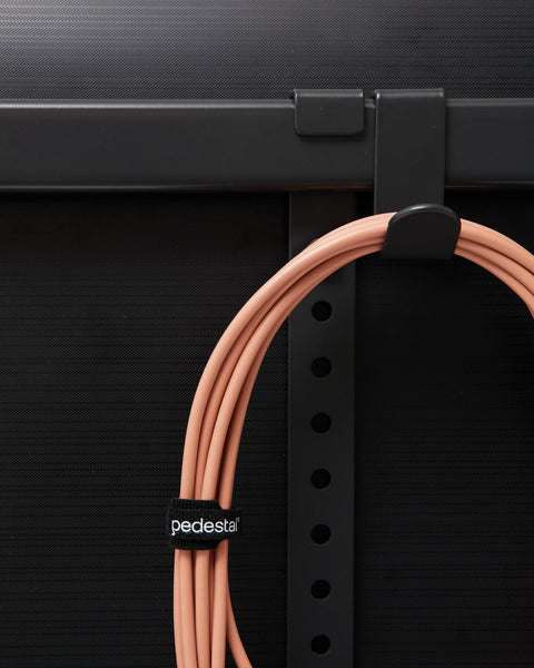 Pedestal Hook Mount in Charcoal, steel accessory hook, holding a coiled cable on the back of a stand