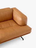 Close up of &Tradition Inland AV23 sofa in cognac leather showing armrest and cushion detail