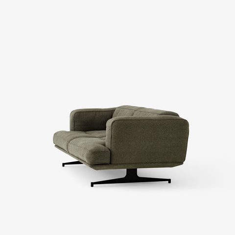 Side view of the Inland AV22 Sofa by &Tradition in clay fabric with sculpted arm and black base