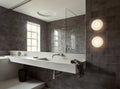 aj eklipta wall lamp by arne jacobsen for louis poulsen in a bathroom