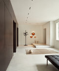 minimalist modern interior with corten color flindt wall lamp designed by christian flindt for louis poulsen