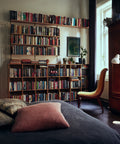 white vl38 floor lamp designed by vilhelm lauritzen in a library room for louis poulsen