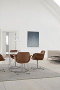 Nutshell leather Flamingo Chairs by Fredericia around white JG Table in bright Scandinavian interior