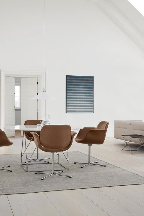 Nutshell leather Flamingo Chairs by Fredericia around white JG Table in bright Scandinavian interior
